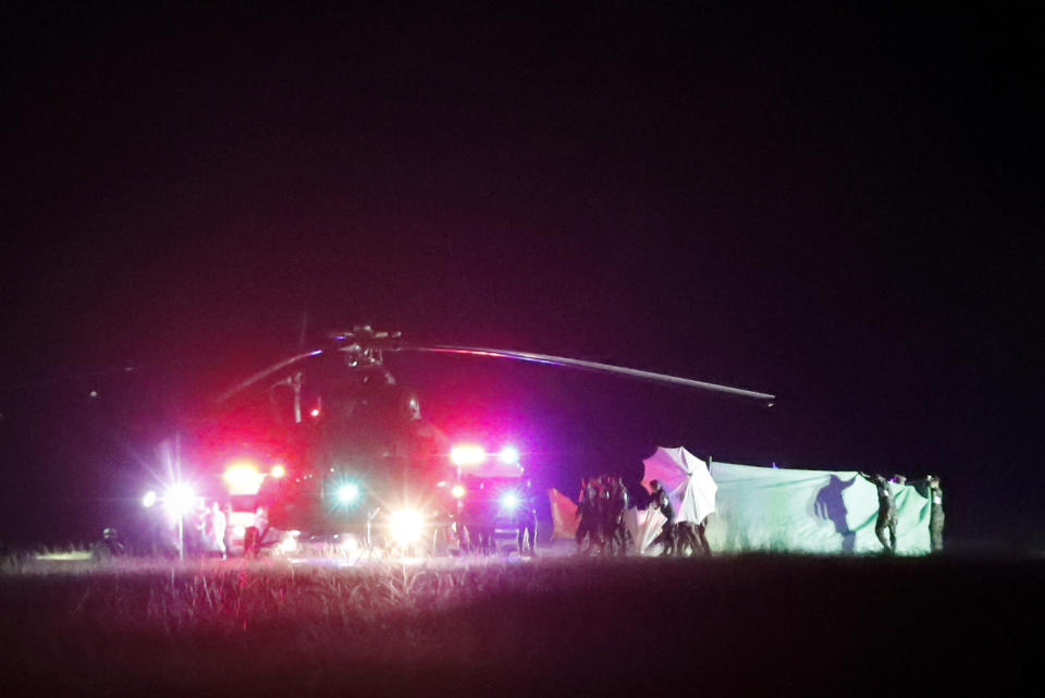 An emergency team believed to be carrying one of the rescued boys from the flooded cave heads to the hospital in Chiang Rai. Source: AP