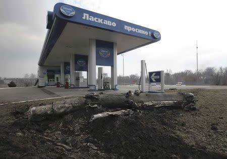 A part of ammunition is seen scattered at a petrol station after ammunition detonated at a military base in the town of Balaklia (Balakleya), Kharkiv region, Ukraine, March 23, 2017. REUTERS/Stanislav Belousov