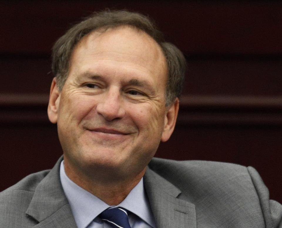 FILE - In this Sept. 14, 2012 file photo, Supreme Court Associate Justice Samuel A. Alito, Jr. listens during an event at Roger Williams University Law School in Bristol, R.I. At the Supreme Court, technology can be regarded as a necessary evil, and sometimes not even necessary. When they have something to say to each other in writing, the justices never do it by e-mail. And the court's historical society says the Supreme Court had no photocopying machine until 1969, a few years after Xerox had become a verb. Alito thinks Congress is better situated than the court to reconcile technology and modern-day expectations of privacy. (AP Photo/Stephan Savoia, File)