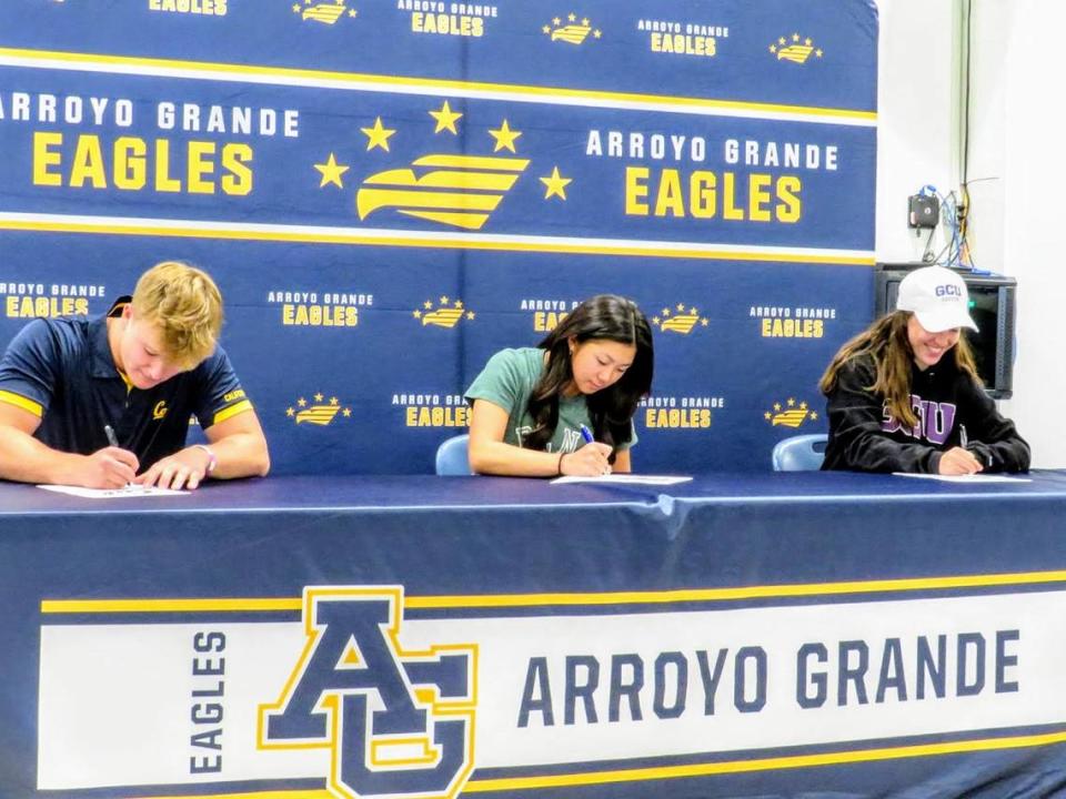 Ryan Tayman (Cal Berkeley baseball), Bella Gunasayan (Point Loma) and Elise Flores (Grand Canyon University) sign their national letters of intent at Arroyo Grande High School in November 2022.