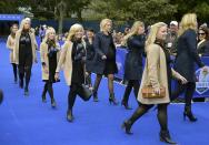 The wives of the U.S. Team (L) and Team Europe arrive for the opening ceremony of the 40th Ryder Cup, at Gleneagles in Scotland September 25, 2014. REUTERS/Toby Melville (BRITAIN - Tags: SPORT GOLF)