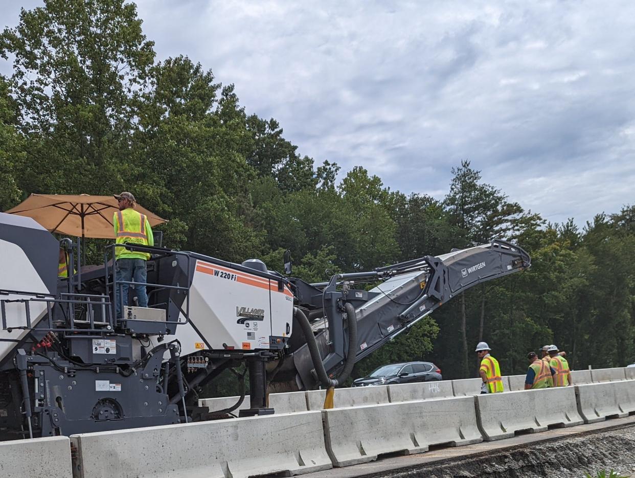 Construction crews work to fix I-26 near mile marker 48 on Aug. 11 after a crash resulted in a fuel leak which broke down the asphalt.