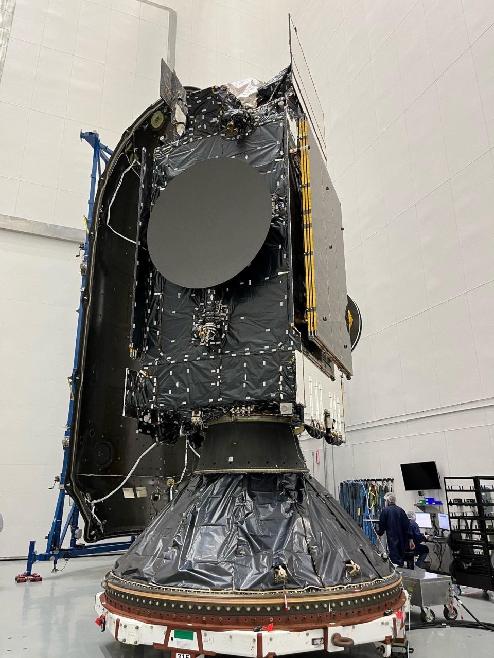 The Intelsat 40e satellite and its hosted pollution-monitoring NASA payload known as TEMPO is encapsulated into the payload fairings of a SpaceX Falcon 9 rocket ahead of launch vehicle integration.