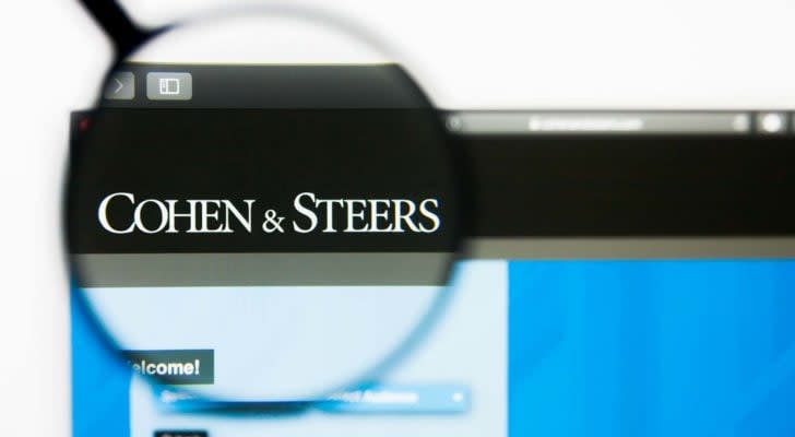 A magnifying glass zooms in on the Cohen & Steers, Inc. (CNS) logo