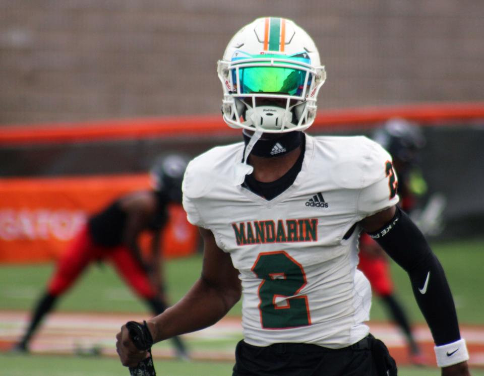 Mandarin wide receiver Jaime Ffrench Jr. (2) runs through warm-ups before the FHSAA Class 4M high school football championship game against Miami Columbus.