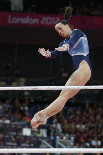 Britain's Beth Tweddle performs to win bronze during the women's uneven bars of the artistic gymnastics event of the London Olympic Games at the 02 North Greenwich Arena in London. Russia's gymnast Aliya Mustafina won gold and China's He Kexin took silver