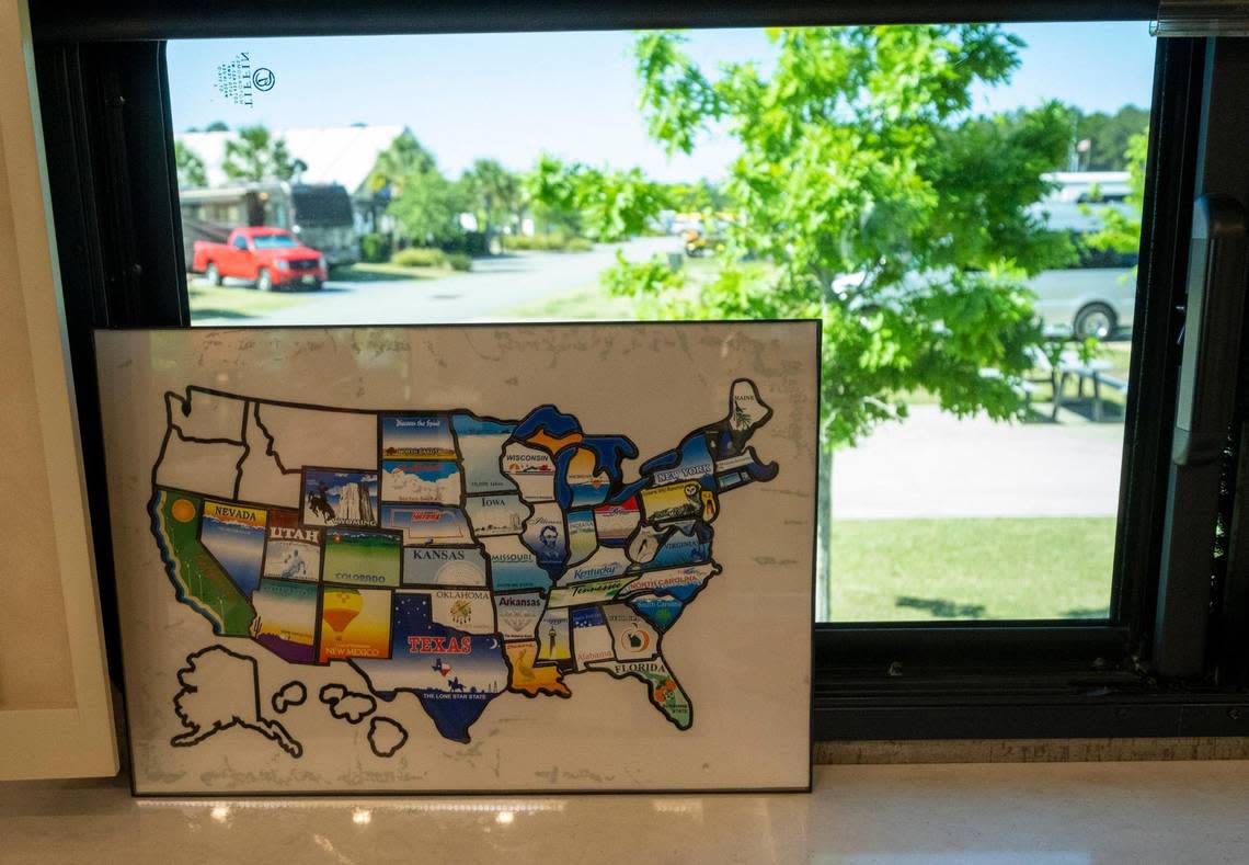 A map in the window of Deanna Cochran and Joel Allen’s motor home displays all the states the couple have visited. The couple have made their motor home their permanent home traveling around the country in their vehicle with Cochran working remotely as Allen drives. April 18, 2023.