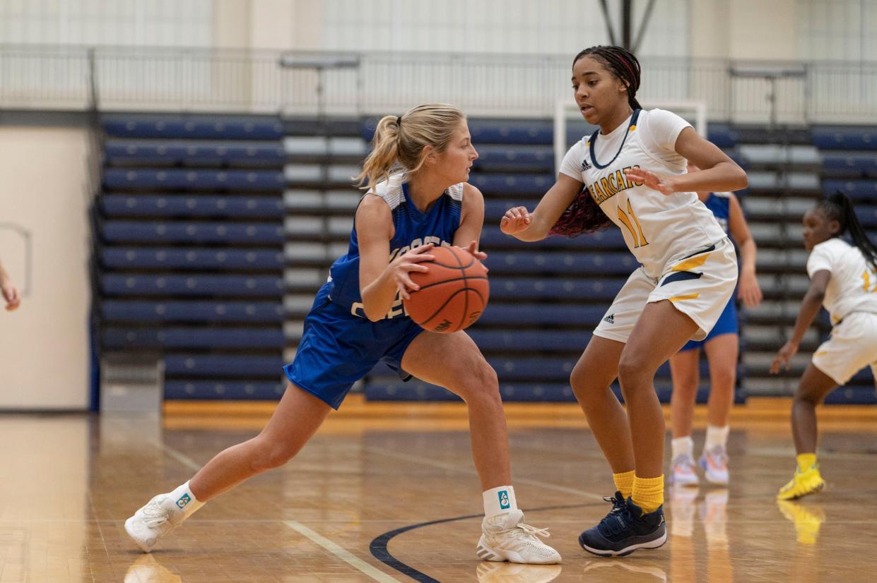 Harper Creek senior Maddie Berning dribbles during a game at Battle Creek Central High School on Friday, Dec. 2, 2022.