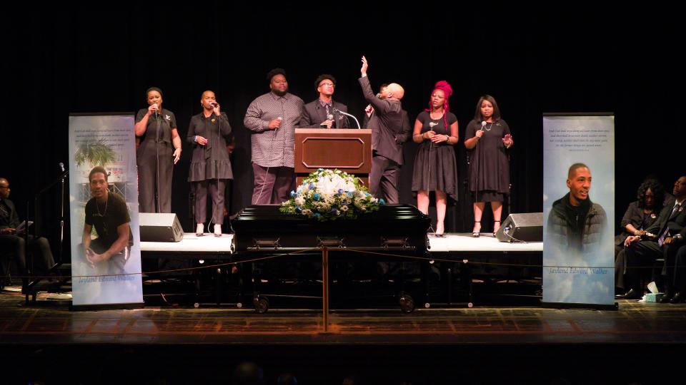 People sing at the funeral service for Jayland Walker at the Akron Civic Theatre on July 13.