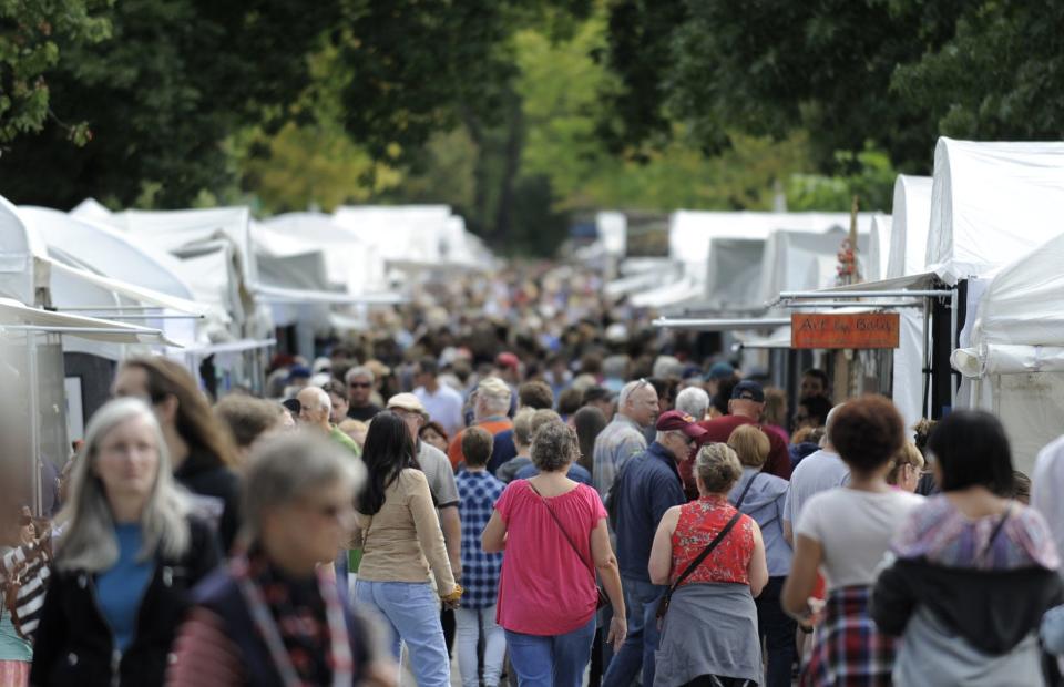 Throngs of visitors fill East Fourth Street during the 2017 Fourth Street Festival of the Arts and Crafts. The annual Bloomington arts fair was first held in 1977. This year, the booths will be farther apart and there will be no live music or spoken word events.