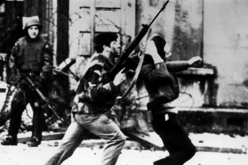 A British paratrooper takes a captured youth from the crowd on Bloody Sunday -Credit:Getty Images