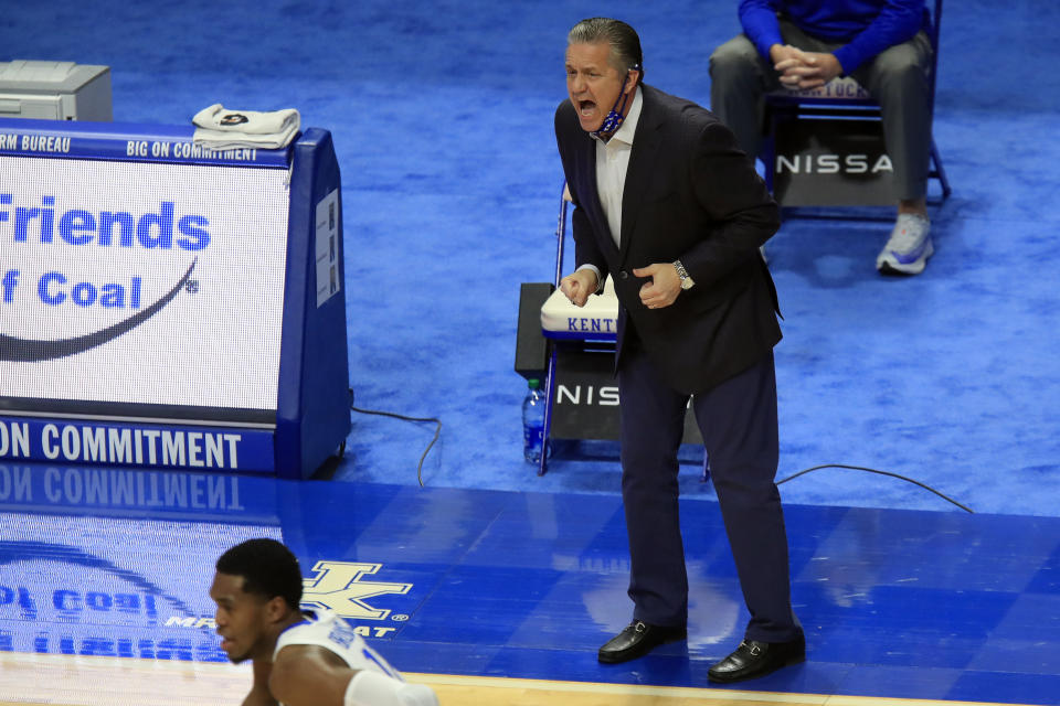 Kentucky coach John Calipari yells to the team during the first half of an NCAA college basketball game against Alabama in Lexington, Ky., Tuesday, Jan. 12, 2021. (AP Photo/James Crisp)