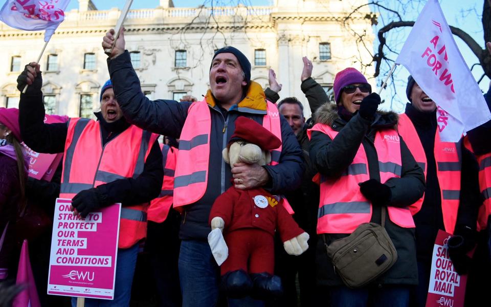 Postal workers on strike in the run-up to Christmas - REUTERS/Toby Melville