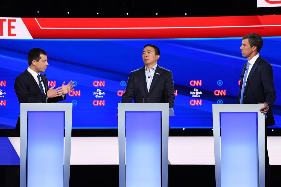 Democratic presidential hopefuls, Mayor of South Bend, Indiana Pete Buttigieg (L), entrepreneur Andrew Yang (C), former Representative for Texas Beto O'Rourke, participate in the fourth Democratic primary debate of the 2020 presidential campaign.