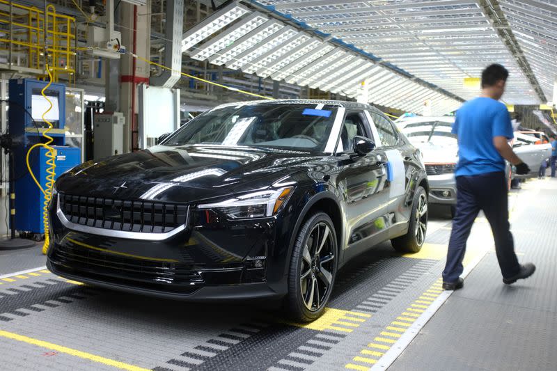 Workers are seen on a production line for Polestar, Volvo and Lynk&Co vehicles at a Geely plant in Taizhou