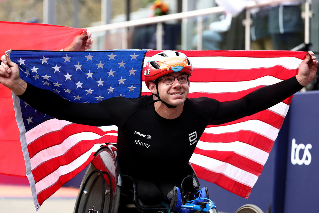 Daniel Romanchuk holds a US flag (Elsa / Getty Images file)