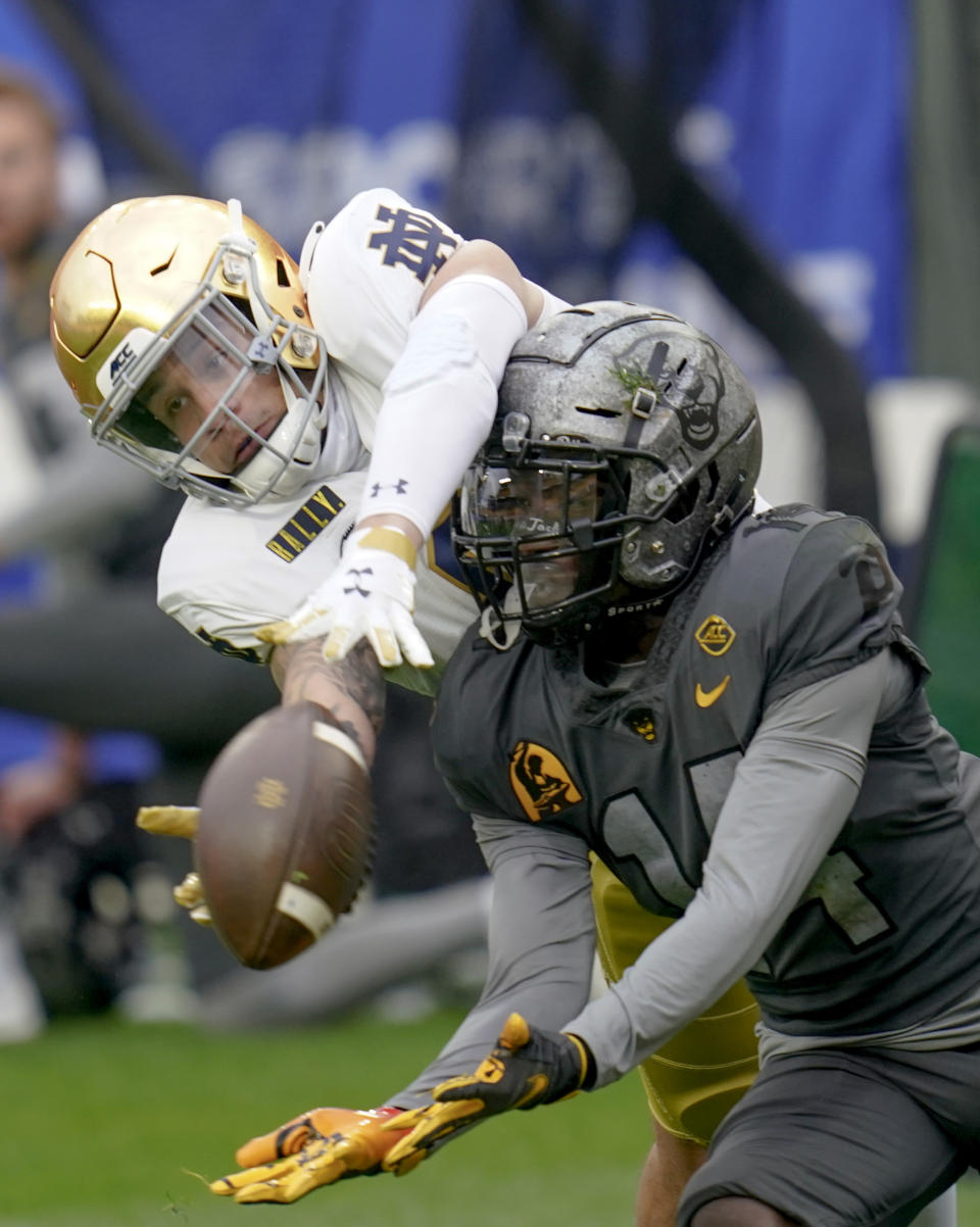 Pittsburgh defensive back Marquis Williams (14) breaks up a pass to Notre Dame wide receiver Braden Lenzy (0) during the first half of an NCAA college football game, Saturday, Oct. 24, 2020, in Pittsburgh. (AP Photo/Keith Srakocic)