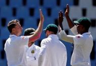 Cricket - New Zealand v South Africa - second cricket test match - Centurion Park, Centurion, South Africa - 29/8/2016. South Africa's Dale Steyn and Kagiso Rabada celebrate the dismissal of New Zealand's wicketkeeper BJ Watling. REUTERS/Siphiwe Sibeko