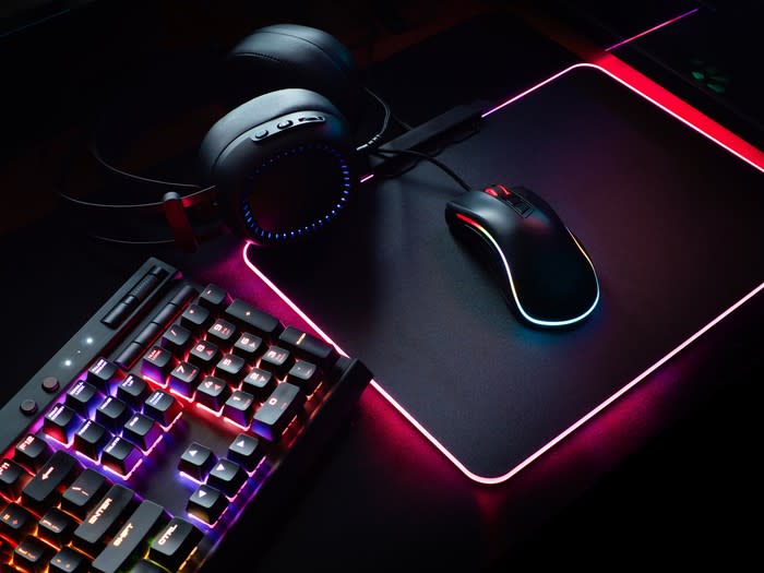 A gaming keyboard, mouse, and headset.