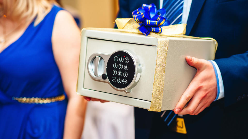 wedding guest holding safe money gift