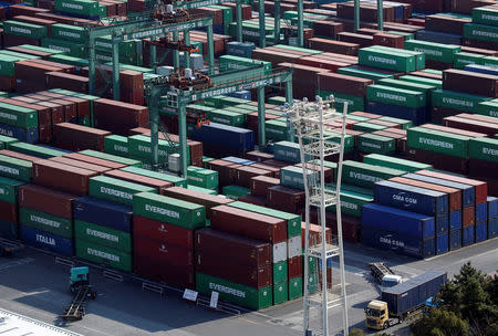 Shipping containers are seen at a port in Tokyo, Japan, March 22, 2017. REUTERS/Issei Kato