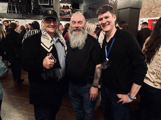 From left, Asgard Brewing Co. founder Stephen Porter, Columbia CARES Executive Director Tim Jones and Winterfest Beer Blast board member Ross Jaynes pause among the chaos of hundreds of patrons attending Friday's Beer Blast event.