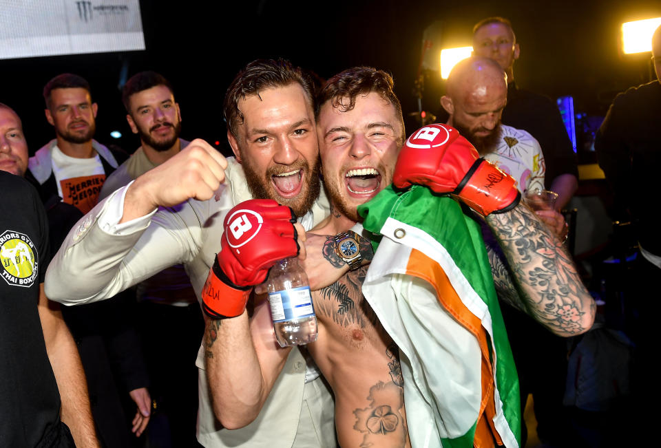 Dublin , Ireland - 27 September 2019; James Gallagher celebrates with team-mate Conor McGregor after defeating Roman Salazar in their contract weight bout at Bellator Dublin in the 3Arena, Dublin. (Photo By David Fitzgerald/Sportsfile via Getty Images)