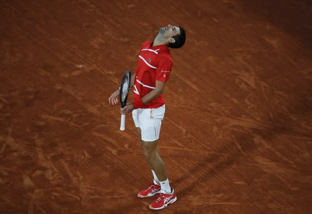 Novak Djokovic roars at the sky during his dramatic semi-final 