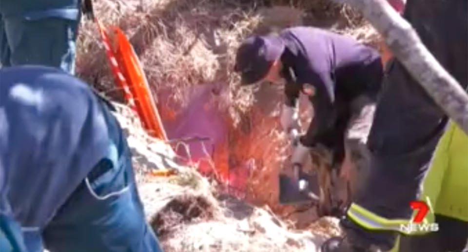 Specialist rescuers dug around him slowly, and carefully, for four hours. Source: 7 News