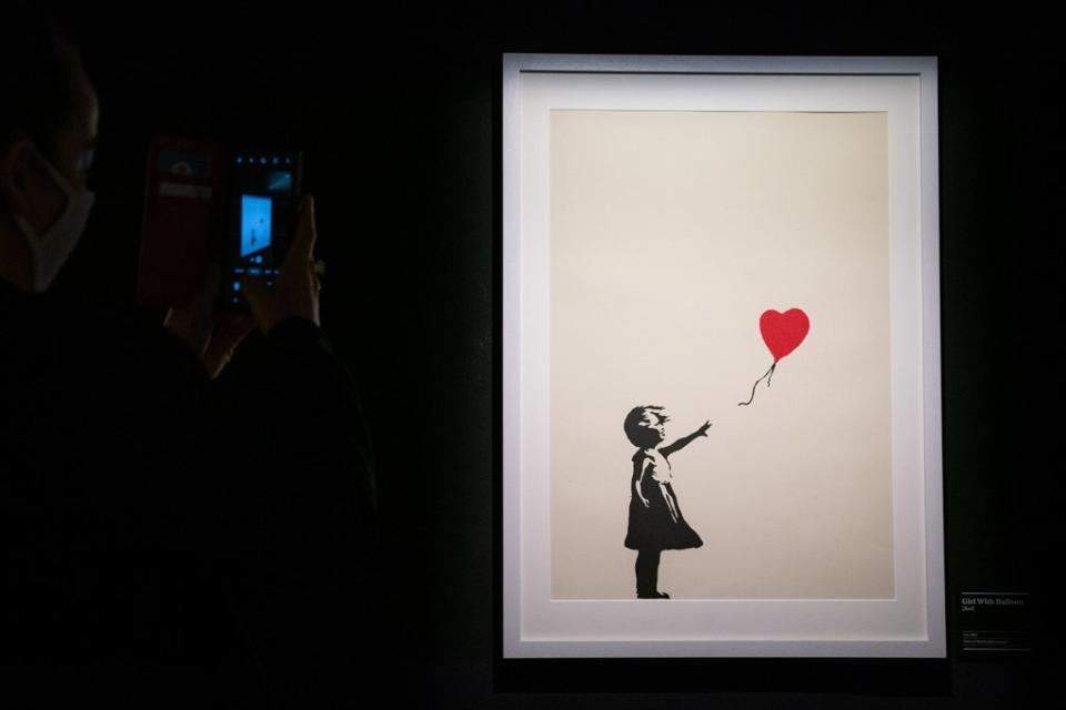 Girl With Balloon was one of Banksy’s best-known works before he partially shredded it and it was renamed Love Is In The Bin (Aaron Chown/PA) (PA Wire)