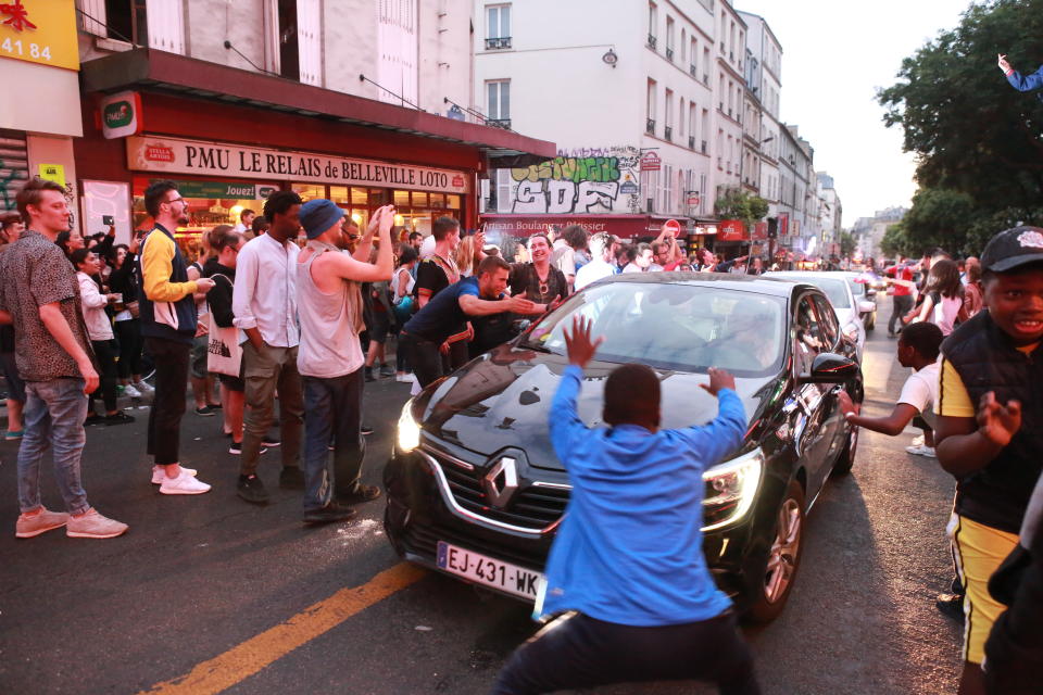 <p>French fans erupt with joy, outside a local bar in the 20th arrondissement, as France wins its semi-final World Cup match against Belgium, on July 10, 2018 in Paris, France. (Photo by Owen Franken – Corbis/Corbis via Getty Images) </p>