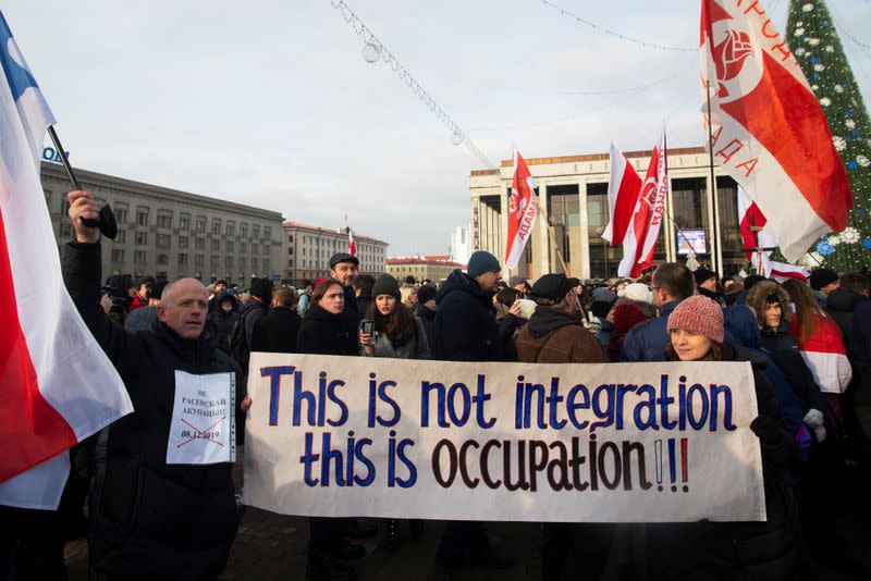 People take part in a rally against integration agreements between Belarus and Russia, in Minsk