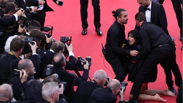 Topless Woman Removed From Cannes Red Carpet After Pro-Ukraine