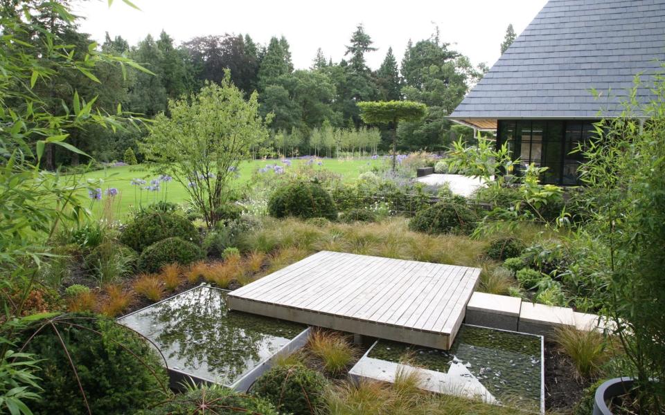 A private yoga plinth within a newly landscaped garden
