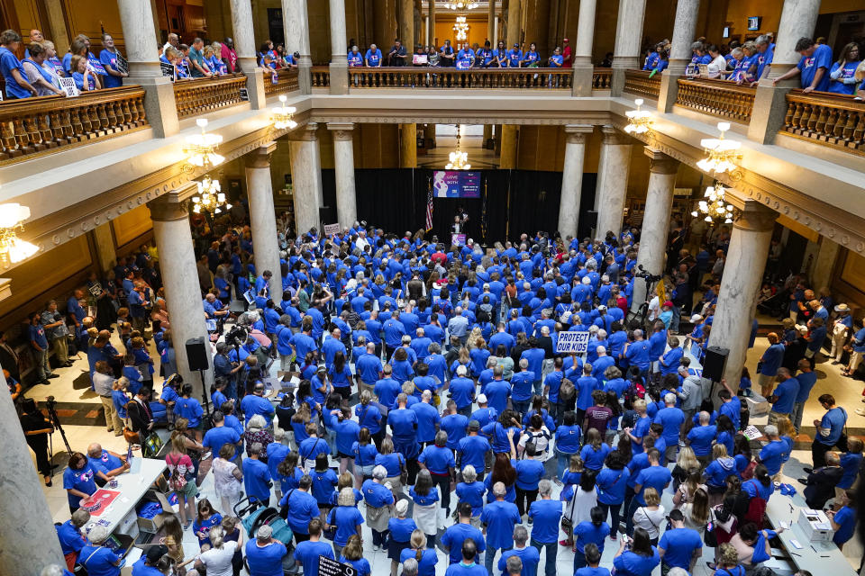 Anti-abortion supporters rally as the Indiana Senate Rules Committee met to consider a Republican proposal to ban nearly all abortions in the state during a hearing at the Statehouse in Indianapolis, Tuesday, July 26, 2022. (AP Photo/Michael Conroy)