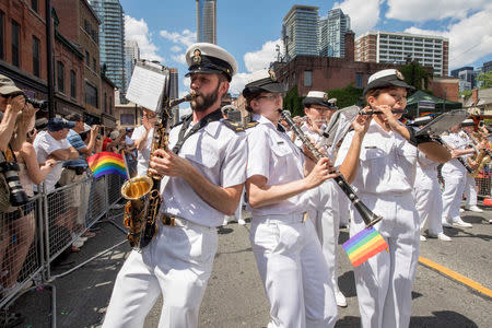 Members of a Canadian naval band perform during the Pride parade in Toronto July 3, 2016, in a photo that was tweeted by the Canadian Forces Twitter account July 26, 2017, hours after U.S. President Donald Trump said he would ban transgender people from the U.S. military. "We welcome Cdns of all sexual orientations and gender identities. Join us!" said the tweet, which included the hashtag #DiversityIsOurStrength. Canadian Forces/Handout via REUTERS.