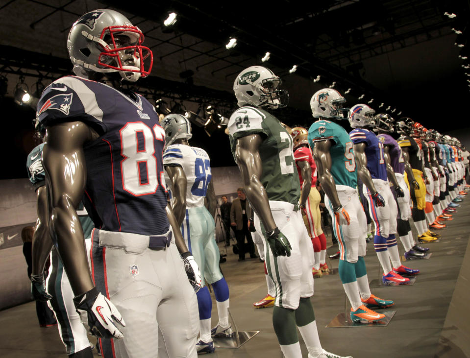 New NFL uniforms are displayed on mannequins during a presentation in New York, Tuesday, April 3, 2012.  The NFL and Nike showed off the new look in grand style with a gridiron-styled fashion show at a Brooklyn film studio. (AP Photo/Seth Wenig)