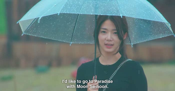 Ji-yeon holds an umbrella in the rain and says "I'd like to go Paradise with Moon Se-hoon"