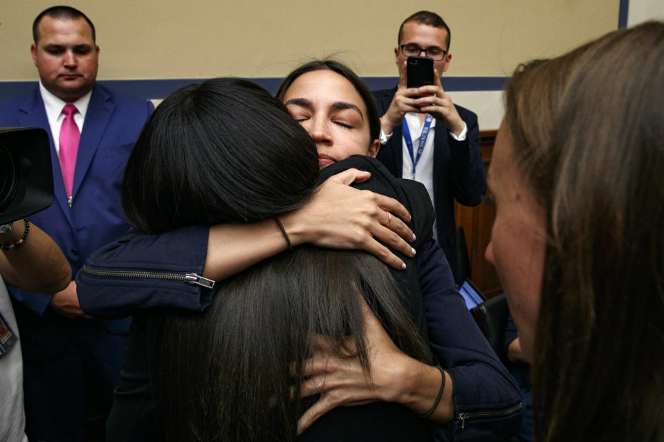 Rep. Alexandria Ocasio-Cortez, D-N.Y., hugs Yazmin Juárez, whose daughter Mariee, 1, died after being released from detention by U.S. Immigration and Customs Enforcement (ICE), after Juárez testified to a House Oversight subcommittee hearing on Civil Rights and Civil Liberties about the treatment of immigrant children at the southern border, Wednesday, July 10, 2019, on Capitol Hill in Washington. (AP Photo/Jacquelyn Martin)