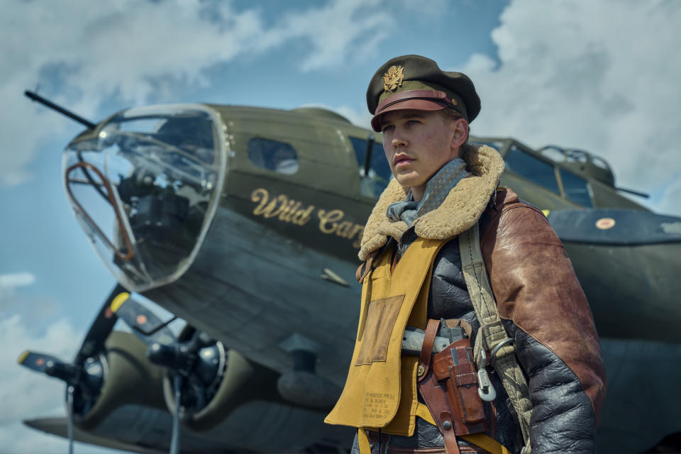 Austin in front of a plane in a scene from "Masters of the Air"