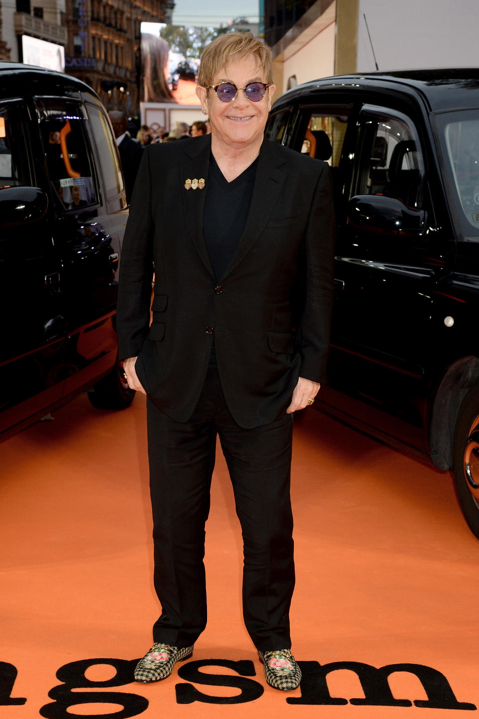 <p>Singer Elton John maintained a youthful glow at the “Kingsman: The Golden Circle'”World Premiere in floral pattered loafers and a jet black suit. <i>(Image via Getty)</i> </p>