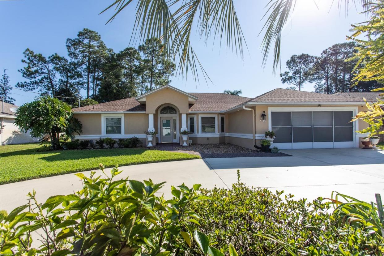 This move-in-ready Palm Coast pool home has it all, including a great outdoor entertainment area.