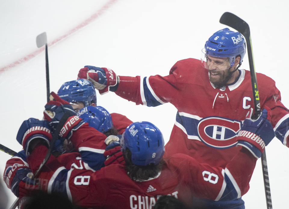 Montreal Canadiens celebrate a goal by Cole Caufield against the against Vegas Golden Knights during the second period of Game 3 of an NHL hockey semifinal series, Friday, June 18, 2021, in Montreal. (Graham Hughes/The Canadian Press via AP)