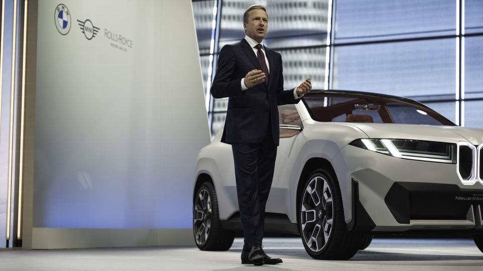 a man standing next to a car