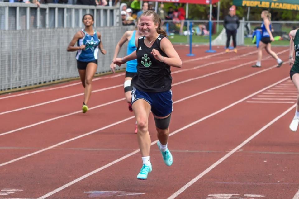 Colcheste's Brinlee Gilfillan wins the girls 200 meter sprint at the 51st annual Burlington High School Track and Field Invitational on Saturday.