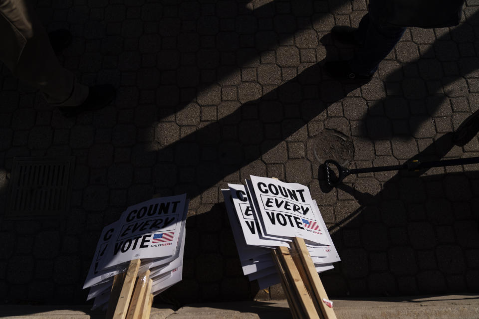 Signs sit on the ground before a rally calling for every vote to be counted from yesterday's general election near the Detroit Department of Elections building in Detroit, Mich., Wednesday, Nov. 4, 2020. (AP Photo/David Goldman)
