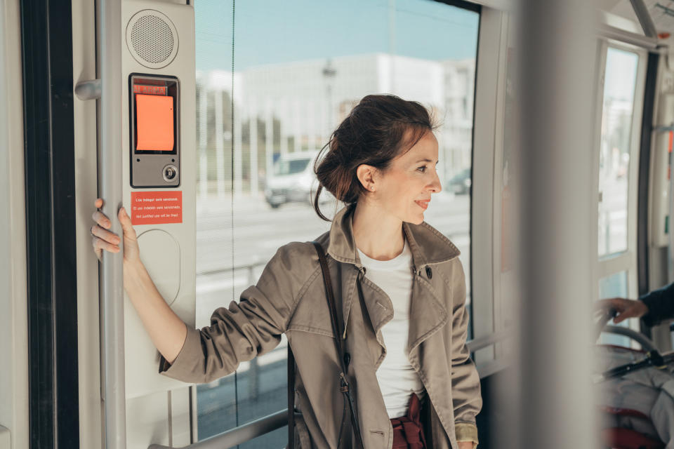 A woman riding public transportation.