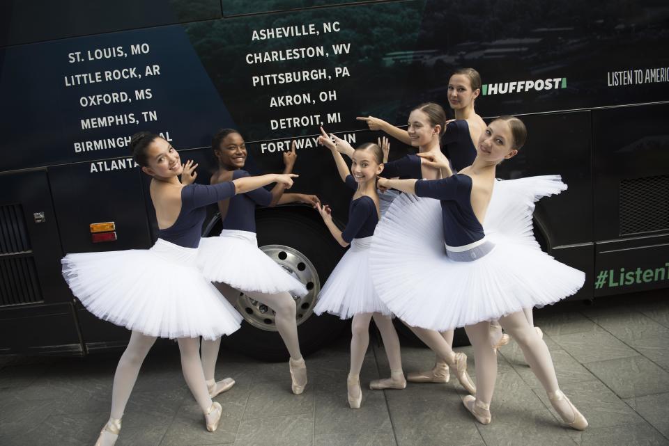 Dancers from Ballet Detroit pose for a photo&nbsp;in front of the bus.