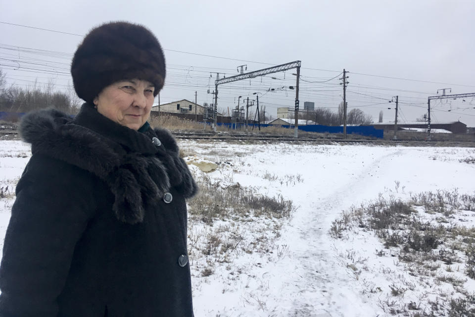 Lidia Radchenko, 73-year-old, who has three sons living in Ukraine, and a son and a daughter in Russia, as she waits to cross the border to Ukraine in Chertkovo, Russia, Sunday, Dec. 2, 2018. On the map Chertkovo and Milove is one village, which is crossed by the main road called Friendship of People's Street, that is split in two by a barbed wire border between Ukraine and Russia. People on the streets easily mix both Russia and Ukrainian languages without making a political statement of it, but earlier this year, Russia built a barbed wire fence across the villages, marking the border with Ukraine in a metaphorical statement about the long-simmering conflict between the countries. (AP Photo/Nataliya Vasilyeva)