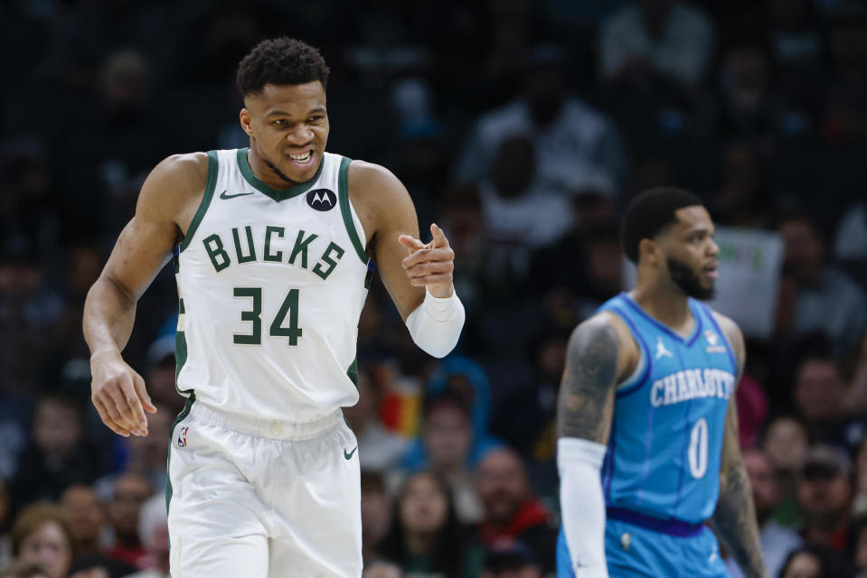 Milwaukee Bucks forward Giannis Antetokounmpo (34) points to a teammate after being fouled as Charlotte Hornets forward Miles Bridges (0) looks on during the first half of an NBA basketball game in Charlotte, N.C., Thursday, Feb. 29, 2024. (AP Photo/Nell Redmond)